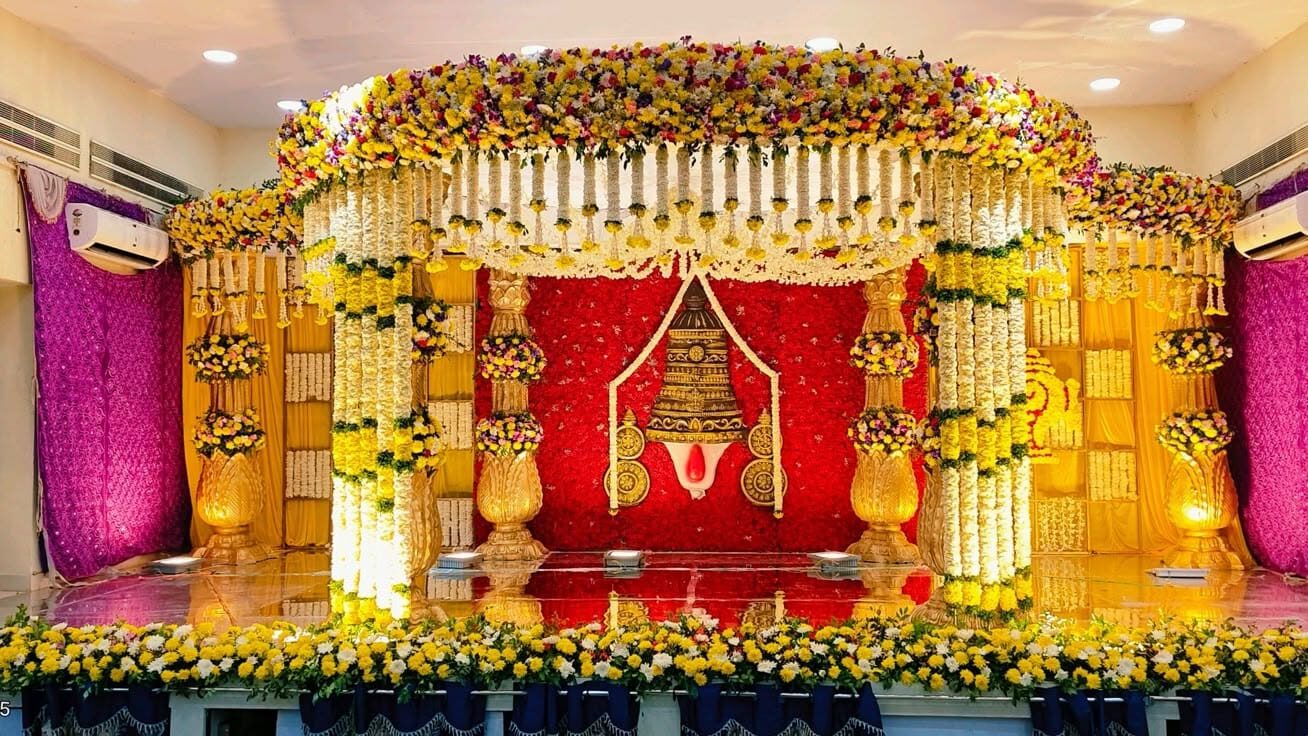 Traditional muhurtham stage decoration with floral canopy in Hyderabad