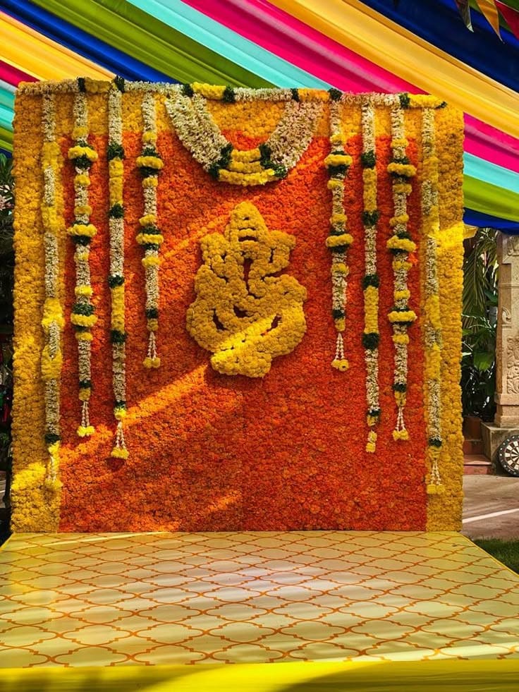 Ganesh floral backdrop decoration with marigold flower wall in Hyderabad