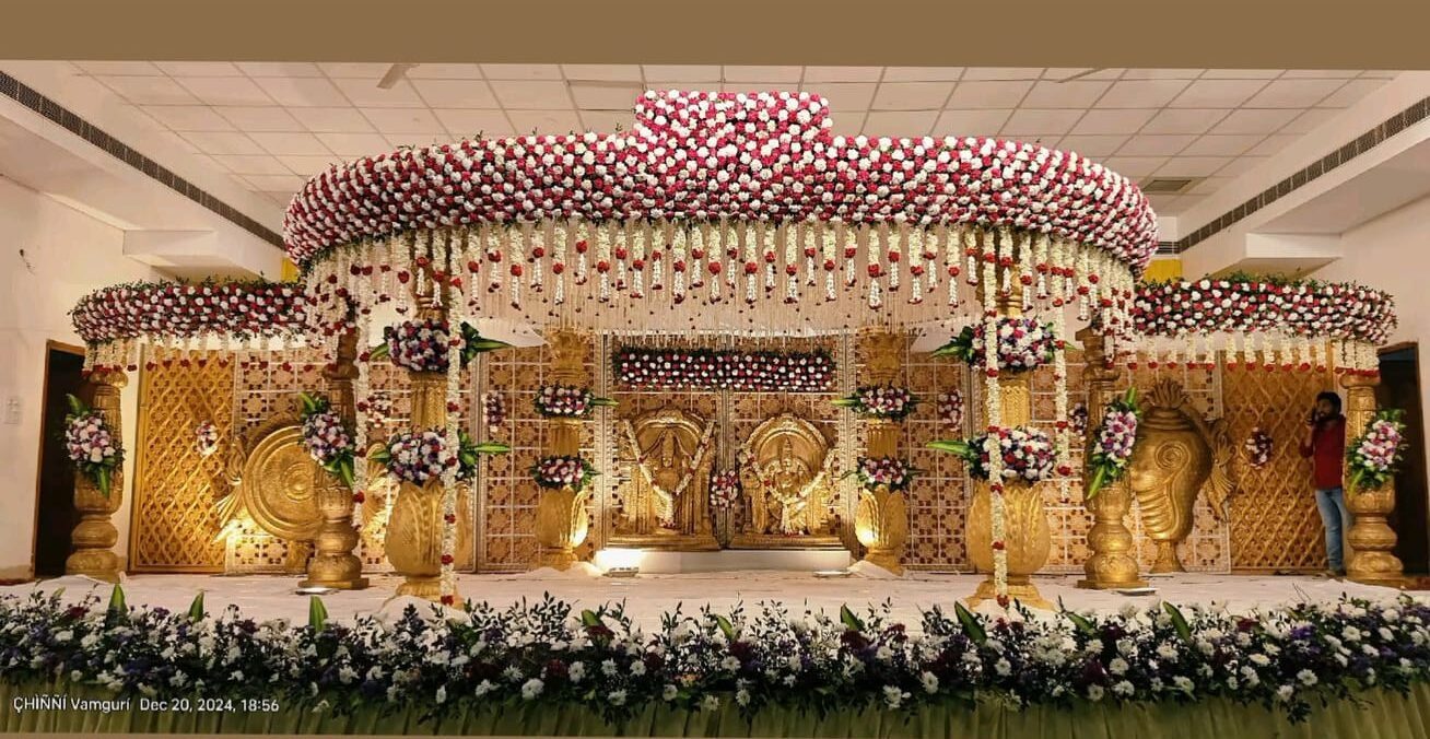 Grand wedding mandap decoration with circular floral canopy and traditional gold stage setup in Hyderabad.